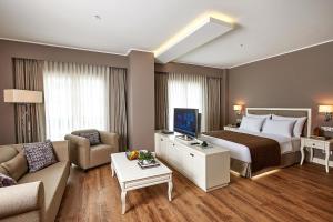 a large hotel room with a bed and a couch at Renata Boutique Hotel Sisli in Istanbul +77 photos