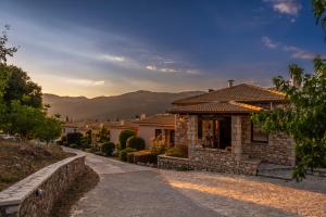 a house with a pathway leading to it at Finday Eco Boutique Hotel in Kalavrita