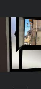 a view of a window with a view of a building at La Cupola - casa vacanze in Termini Imerese