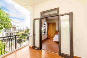 a balcony with a view of a bedroom at Villa Hero 5 bed roooms near beach, luxury swimming pool in Da Nang