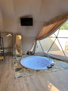 a tent with a tub in the middle of a room at Evasion Sapanca in Sapanca
