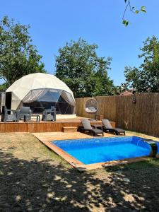 a backyard with a swimming pool and a tent at Evasion Sapanca in Sapanca