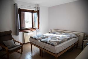 Postel nebo postele na pokoji v ubytování Cascina Pirondini