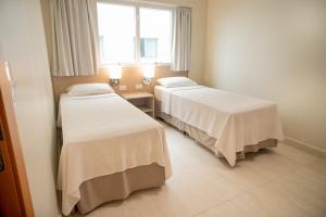 En eller flere senge i et værelse på Salinas Park Resort