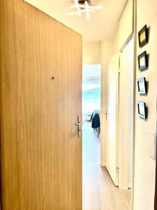 a hallway with a door leading to a room at Little Penthouse **** in Dietikon