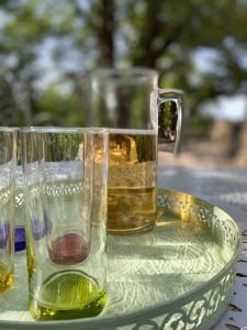 two glasses are sitting on a tray with a drink at Santonne in Apt +34 photos