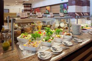 a buffet with many dishes of food on a table at Flamingo Grand Hotel & Spa in Albena