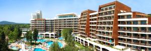 a resort with a swimming pool and some buildings at Flamingo Grand Hotel & Spa in Albena