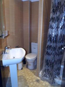 Koupelna v ubytování Plaza Hotel