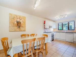 a kitchen and dining room with a table and chairs at Barley Cottage- Uk45598 in Verwick