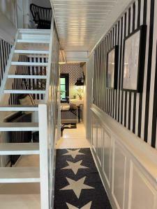 a staircase in a home with black and white stripes at Bondehus in Holeby