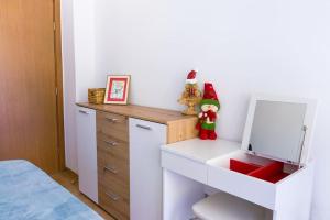 a bedroom with a white desk with a mirror at Mountain Apartment in Borovets Ski Resort in Borovets +5 photos