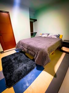 A bed or beds in a room at Posada Mia Copacabana