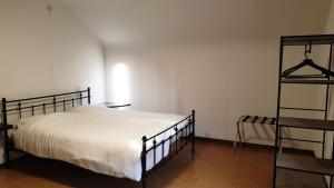 a bedroom with a bed and a book shelf at Brelaarheide in Aan de Wolfsberg