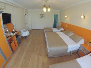 Postel nebo postele na pokoji v ubytování Ayvazali Hotel