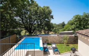 a swimming pool in the backyard of a house at Villa Giorgio Jursici in Svetvinčenat