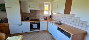 Kuchyň nebo kuchyňský kout v ubytování Ferienwohnung Rauchkofelblick