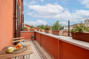 a balcony with a table and a view of a city at Top View Luxury apartment Piazza del Popolo in Rome