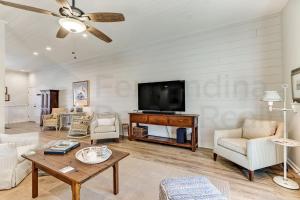 a living room with a couch and a tv at 2505B W, 5th St condo in Fernandina Beach