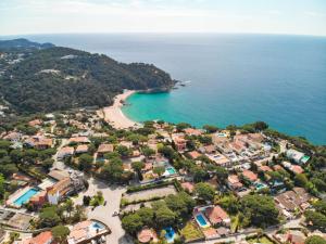an aerial view of a small town with a beach at El Trull Apartaments in Lloret de Mar