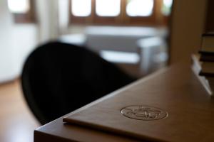 a desk with a black chair sitting at a table at Hotel El Rosal de Cudillero in Cudillero