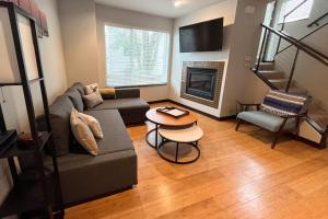 a living room with a couch and a table at Fremontopia in Seattle