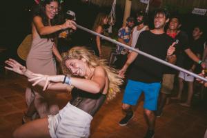 a group of people dancing on a dance floor at Viajero Sayulita Hostel in Sayulita