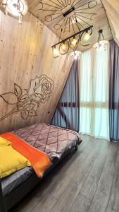 a bedroom with a bed with a fish mural on the wall at Gabala 7 Villa in Vǝndam