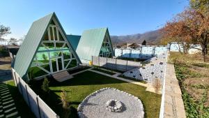 a house with two domes on top of a yard at Gabala 7 Villa in Vǝndam