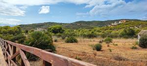 a wooden bridge with a view of a mountain at Adosado en Alcossebre El Faro in Alcossebre
