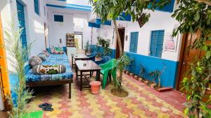 a living room with a couch and a table at Mayur Guest House in Pushkar