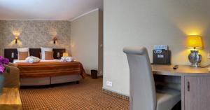 Voodi või voodid majutusasutuse Hotel Pavillon Du Zoute toas