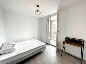 Łóżko lub łóżka w pokoju w obiekcie Appartement 8 pers Moulin à vent Alduy