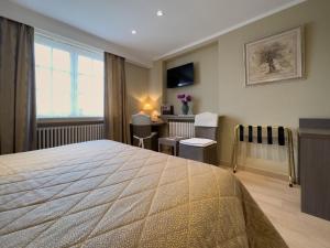 Voodi või voodid majutusasutuse Hotel Pavillon Du Zoute toas
