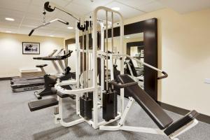a gym with treadmills and elliptical machines at Holiday Inn Express and Suites Fort Lauderdale Airport West, an IHG Hotel in Davie