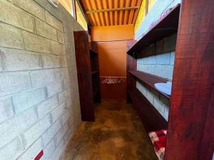 a hallway of a room with a brick wall at Chalet Zen Bella Vista in Ángeles