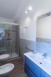 a bathroom with a sink and a toilet and a shower at [vista Sibillini] Villa Amici in Verri