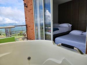 Postel nebo postele na pokoji v ubytování Alojamiento, Penthouse, Dúplex, Jacuzzi