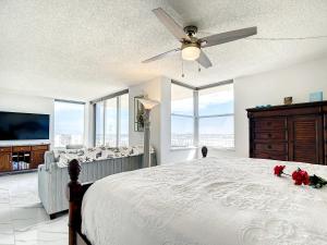 a bedroom with a bed and a ceiling fan at Welcome To The Paradise in Fort Myers Beach