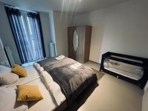 a hotel room with two beds and a mirror at Sonnenschein Appartement in Wuppertal in Wuppertal