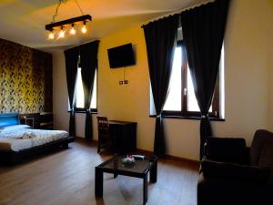 A bed or beds in a room at Camurria Sicilian B&B