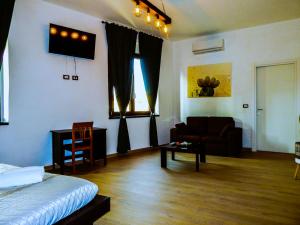A bed or beds in a room at Camurria Sicilian B&B