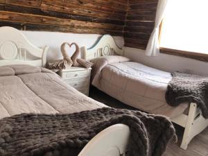 Кровать или кровати в номере FINCA LA PAZ