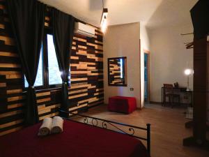 A bed or beds in a room at Camurria Sicilian B&B