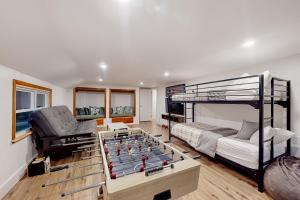 a bedroom with a pool table and a bunk bed at Valkyrie Run in Bridgewater