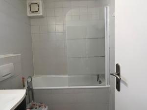 a bathroom with a shower with a white tub at Apartment in Gilching in Gilching
