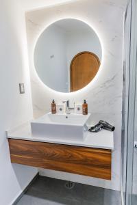 a bathroom with a sink and a mirror at Casa Castillo 15 in Mexico City