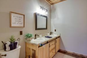 a bathroom with two sinks and a toilet at Modern Lakeside Chalet on Crow Wing Chain with Dock! in Nevis +33 photos