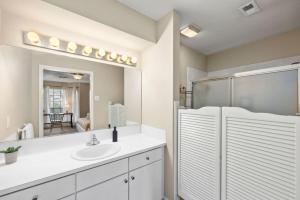a bathroom with a sink and a mirror at Montrose Walk To 50 Restaurants 1 Mile 2 DT in Houston +28 photos