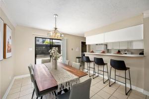 a kitchen and dining room with a table and chairs at Montrose 2-Unit Retreat 4BR Sleeps 20 Near DT in Houston